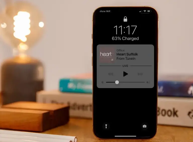 What features can I access from the iPhone lock screen?
